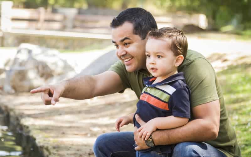 Father with his toddler aged son at the park